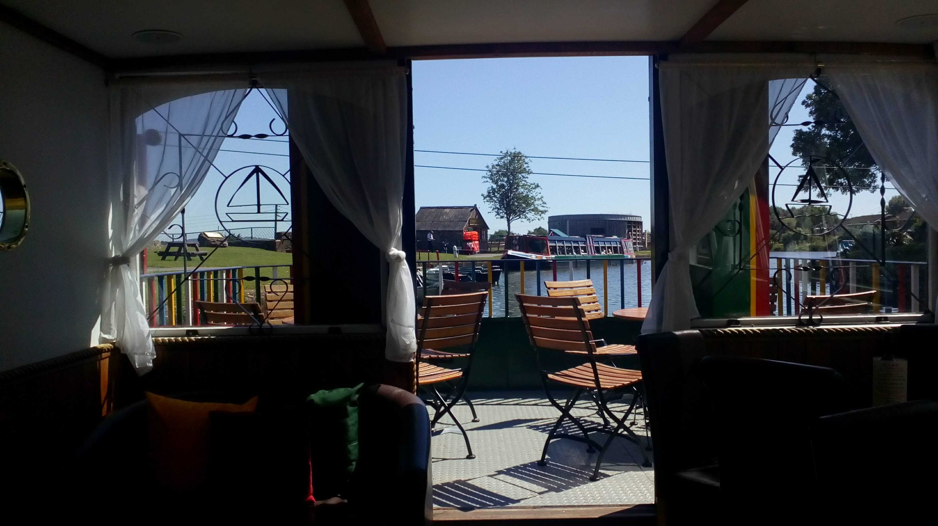 View downstream from the narrowboat cafe on a sunny day